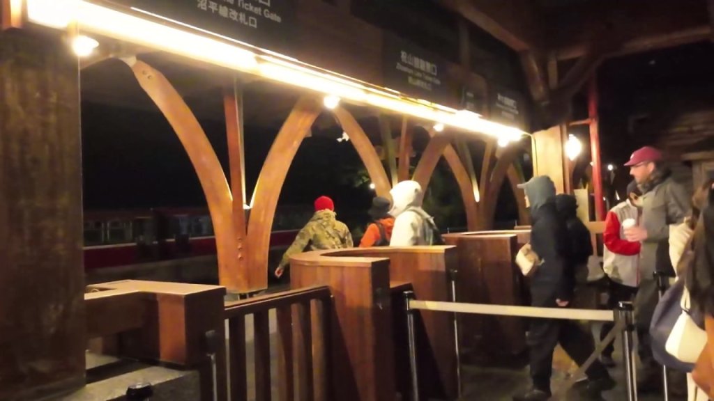 people are walking from Alishan train station to the platform in early morning