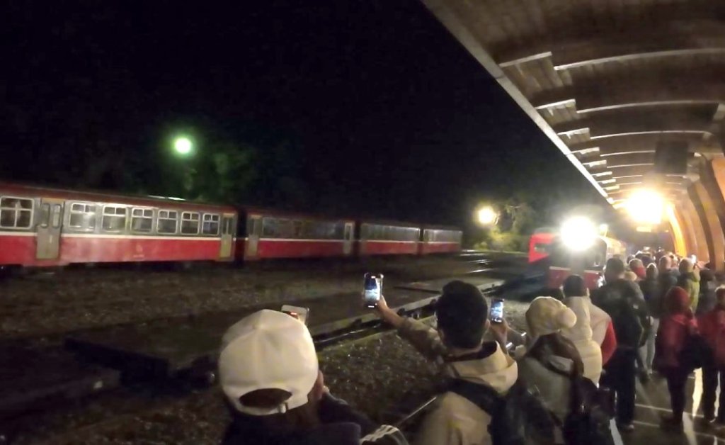 people are waiting for the train to arrive.
