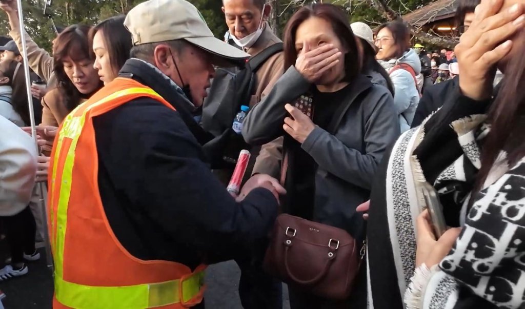 national park officer hands out pine oil for the tourists to test the fragrance