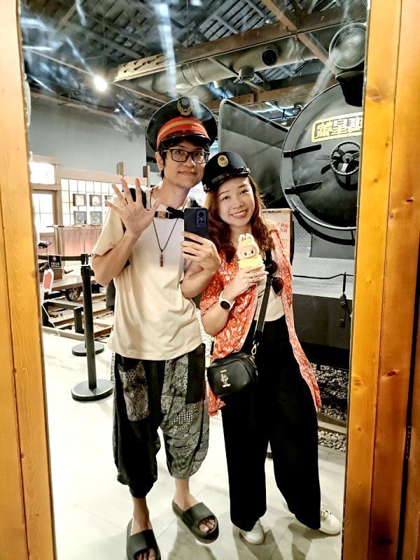 trying out the officer's hats